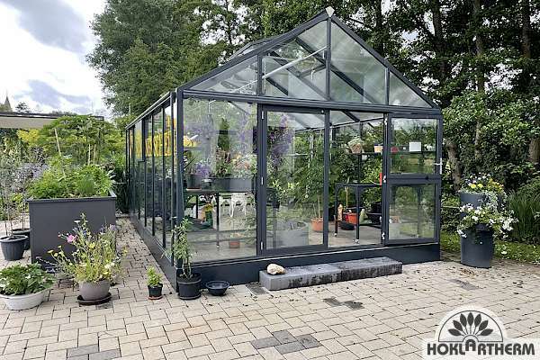 Large greenhouse with sliding door in anthracite