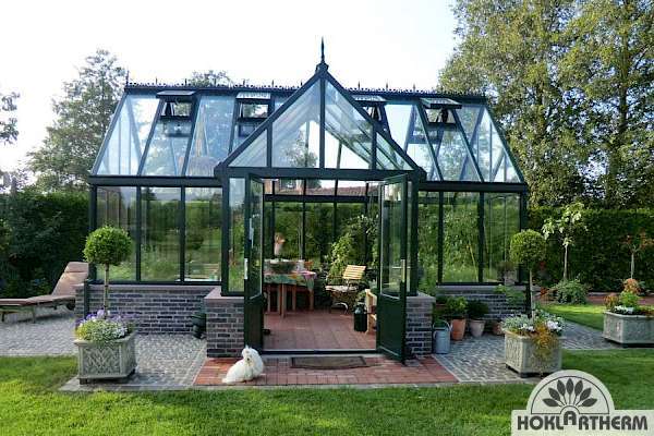 Greenhouse with glass on a brick base