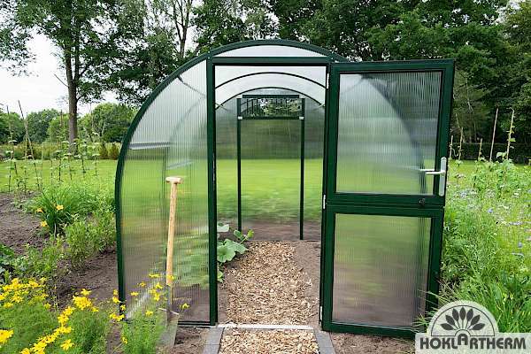 Buy a narrow greenhouse for a small garden