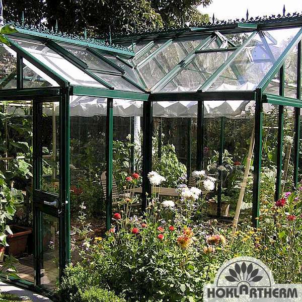 The York glass greenhouse in the rose bed