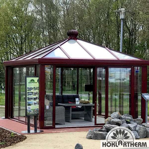 Glass pavilion tea house in the special colour red