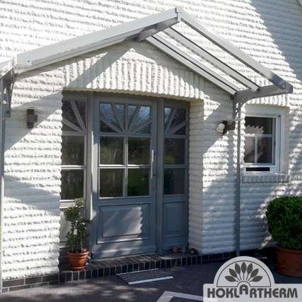 Front door canopy in silver on the house
